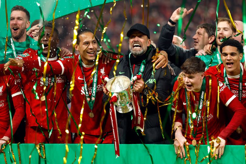 LONDON, ENGLAND - FEBRUARY 25: Virgil van Dijk of Liverpool and Jurgen Klopp, Manager of Liverpool celebrate with trophy after winning the Carabao Cup Final  after the match between Chelsea and Liverpool at Wembley Stadium on February 25, 2024 in London, England. (Photo by Nigel French/Sportsphoto/Allstar via Getty Images)