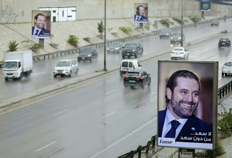 "There is no hapiness without Saad," reads a poster bearing a portrait of Lebanese Prime Minister Saad Hariri reads in Arabic is seen on a billboard on Beirut's airport highway, on November 21, 2017