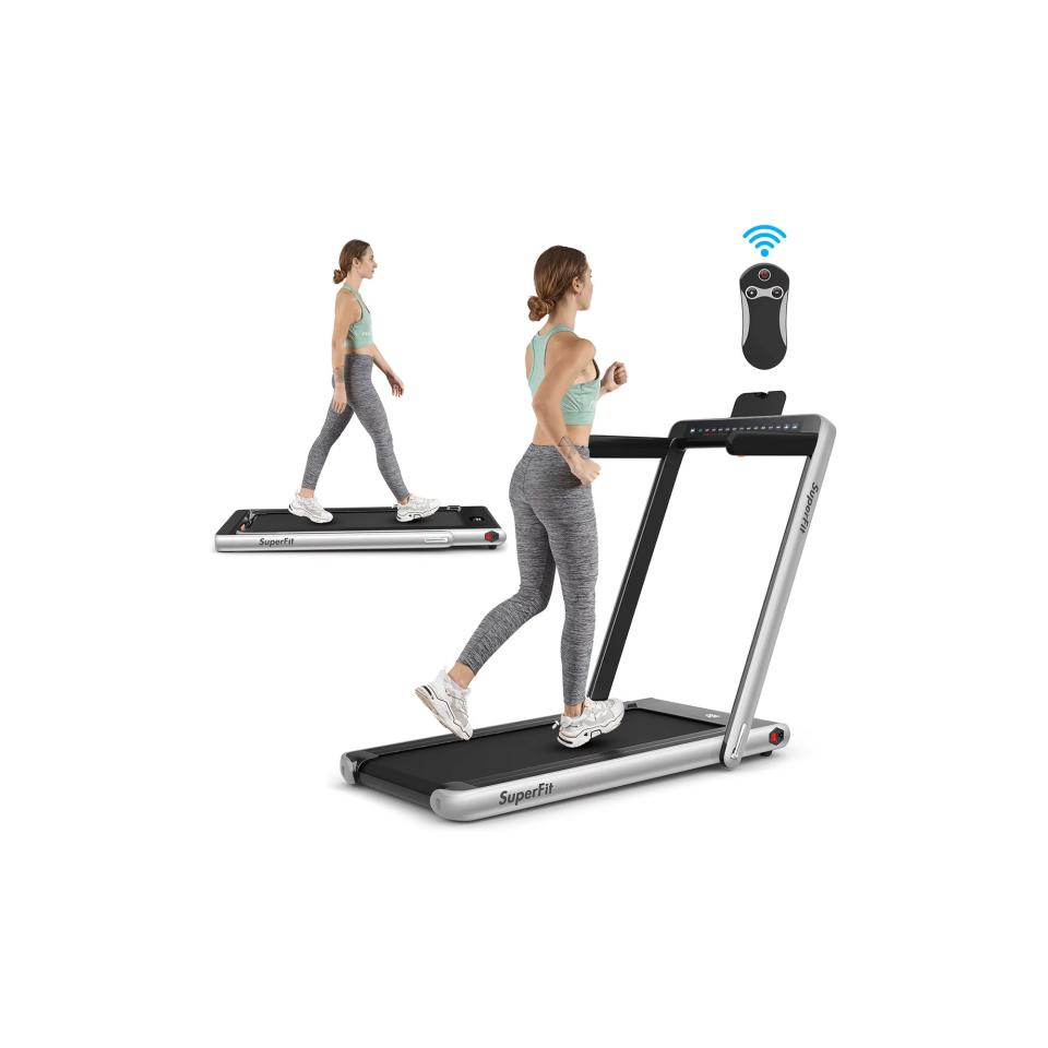 Woman running on SuperFit 2.25HP 2 in 1 Dual Display Folding Treadmill Jogging Machine.