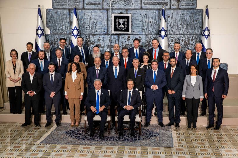 Israel's new far-right government pose for a group photograph, in Jerusalem