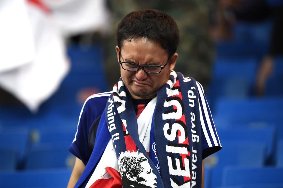 <p>A Japan fan looks dejected following their sides defeat in the 2018 FIFA World Cup Russia Round of 16 match between Belgium and Japan at Rostov Arena on July 2, 2018 in Rostov-on-Don, Russia. (Photo by Carl Court/Getty Images) </p>