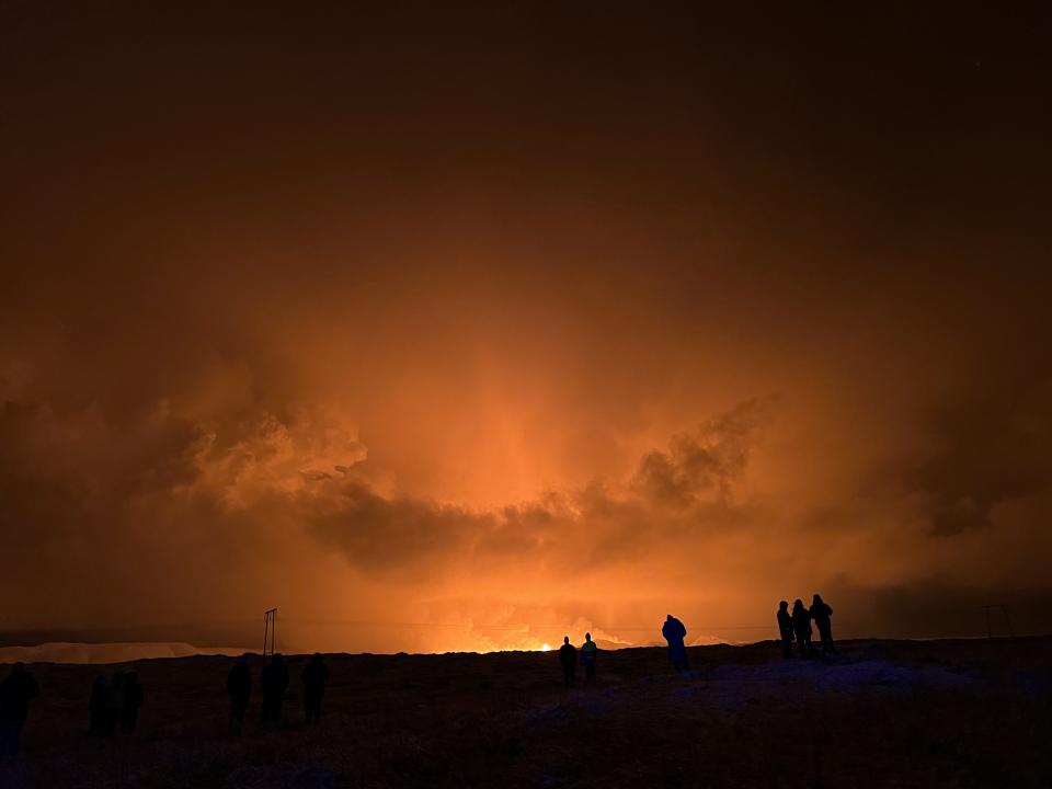 GRINDAVIK, ICELAND - DECEMBER 18: A volcano erupts on the Reykjanes Peninsula near the power station on December 18, 2023 north of Grindavik, Iceland. (Photo by Micah Garen/Getty Images)