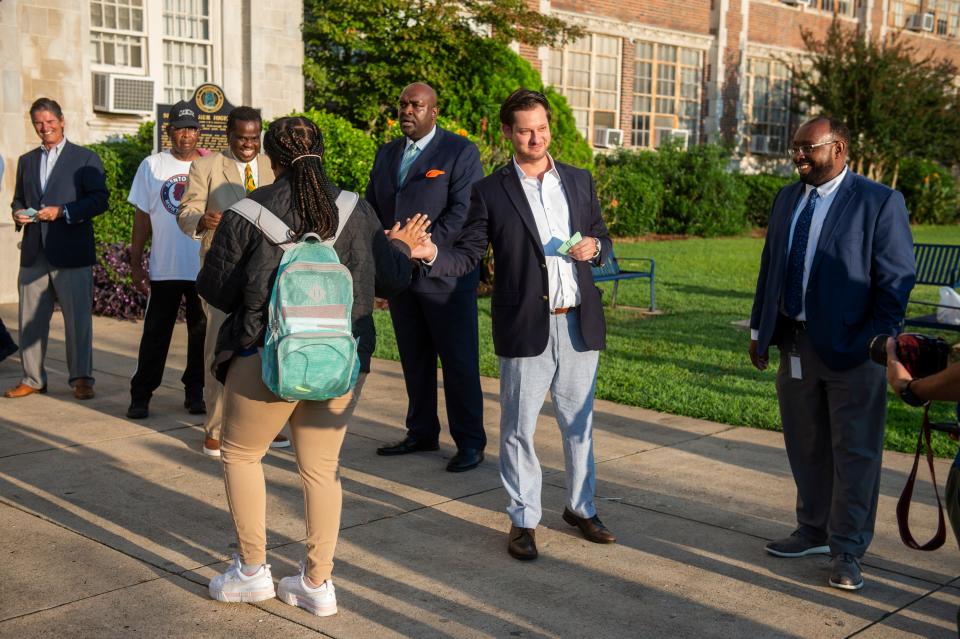 Phillip Ensler  welcomes students at Lanier High School in Montgomery, Ala., on Wednesday, Sept. 14, 2022.