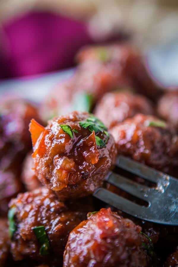 <strong>Get the <a href="https://ohsweetbasil.com/chili-sauce-grape-jelly-slow-cooker-meatballs-recipe/" target="_blank">Chili Sauce And Grape Jelly Slow Cooker Meatballs</a> recipe from Oh Sweet Basil</strong>