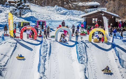 Families snow tubing in Pila, Aosta Valley, Italy - Credit: Valle d'Aosta/Mazzoli