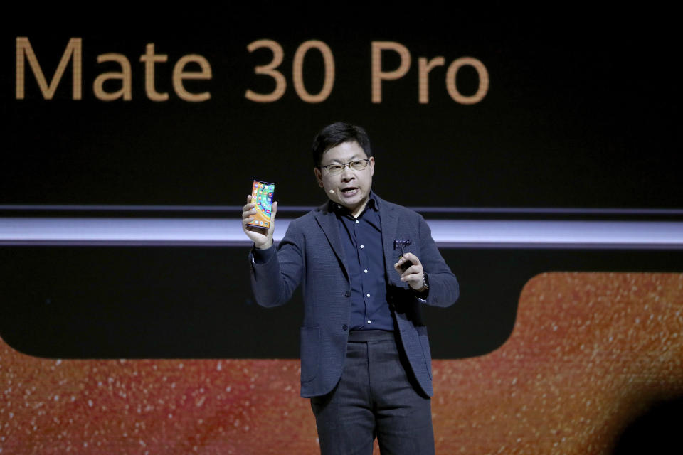 Richard Yu, CEO of the Huawei consumer business group, presents the new 'Mate 30 Pro' smartphone during an event in Munich, Germany, Thursday, Sept. 19, 2019. (AP Photo/Matthias Schrader)