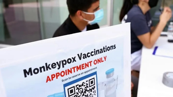 Health workers last week await patients at a check-in table at a pop-up monkeypox vaccination clinic that the Los Angeles County Department of Public Health opened at the West Hollywood Library. California Gov. Gavin Newsom declared a state of emergency on Aug. 1 because of an outbreak of monkeypox, which continues to spread globally. (Photo: Mario Tama/Getty Images)