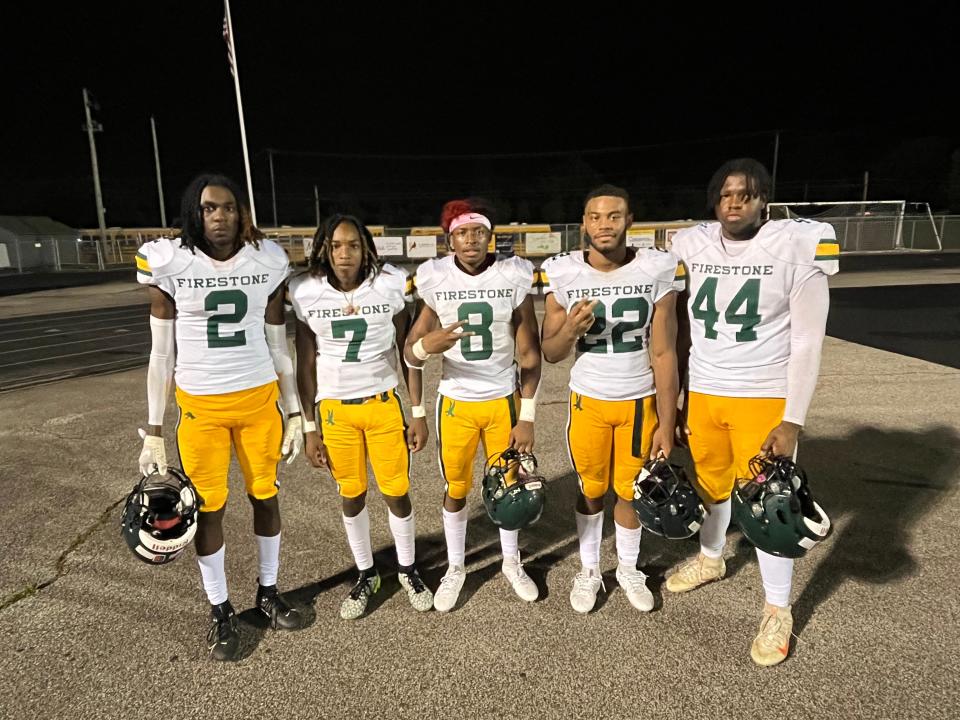 Firestone football players, from left to right, Matthew White, Daylyn Taylor, Daniel Peterson, Dionte Younger and William Calhoun pose for a photo after a win over Copley on Aug. 25, 2023.