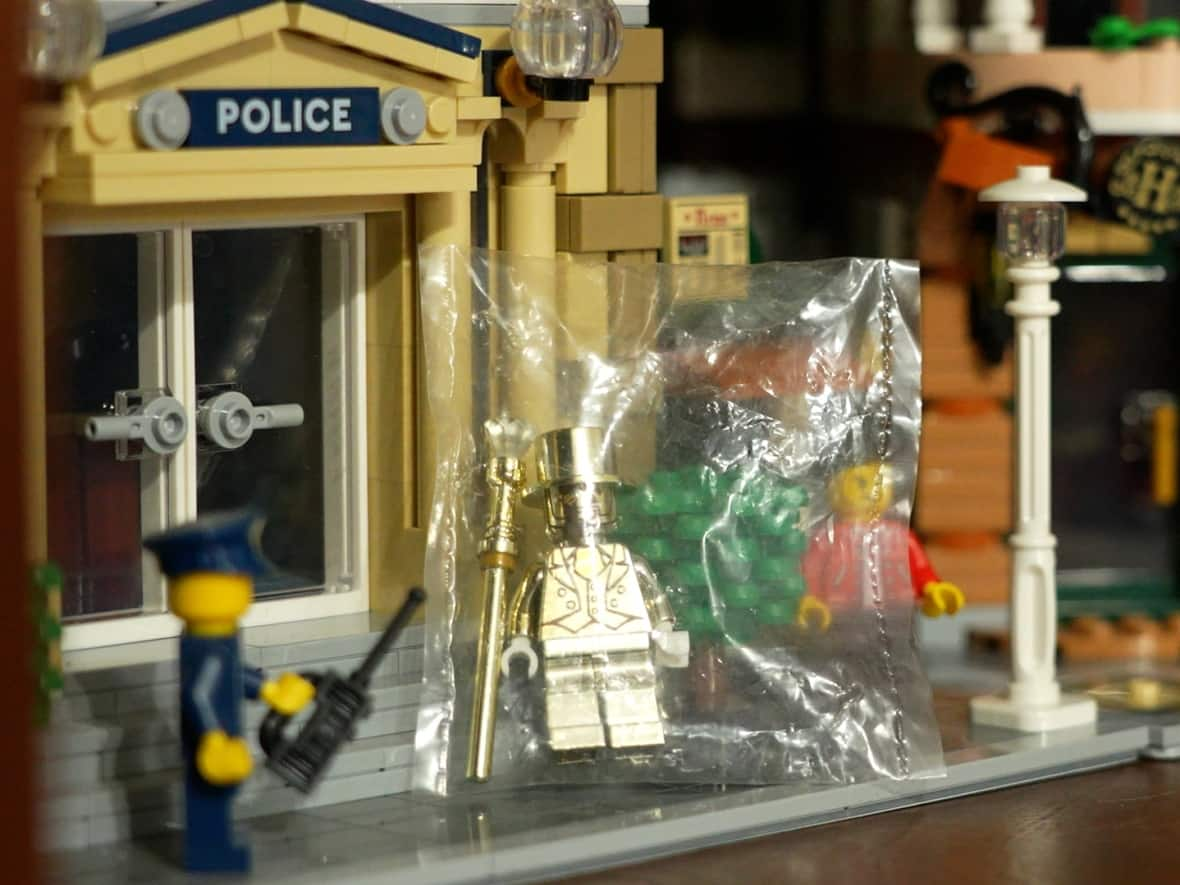 Mr. Gold is a rare Lego minifigure that is valued at $6,500 US. Matthew Fox of Victoria, B.C., is selling his for $7,200 Cdn.  (Claire Palmer  - image credit)