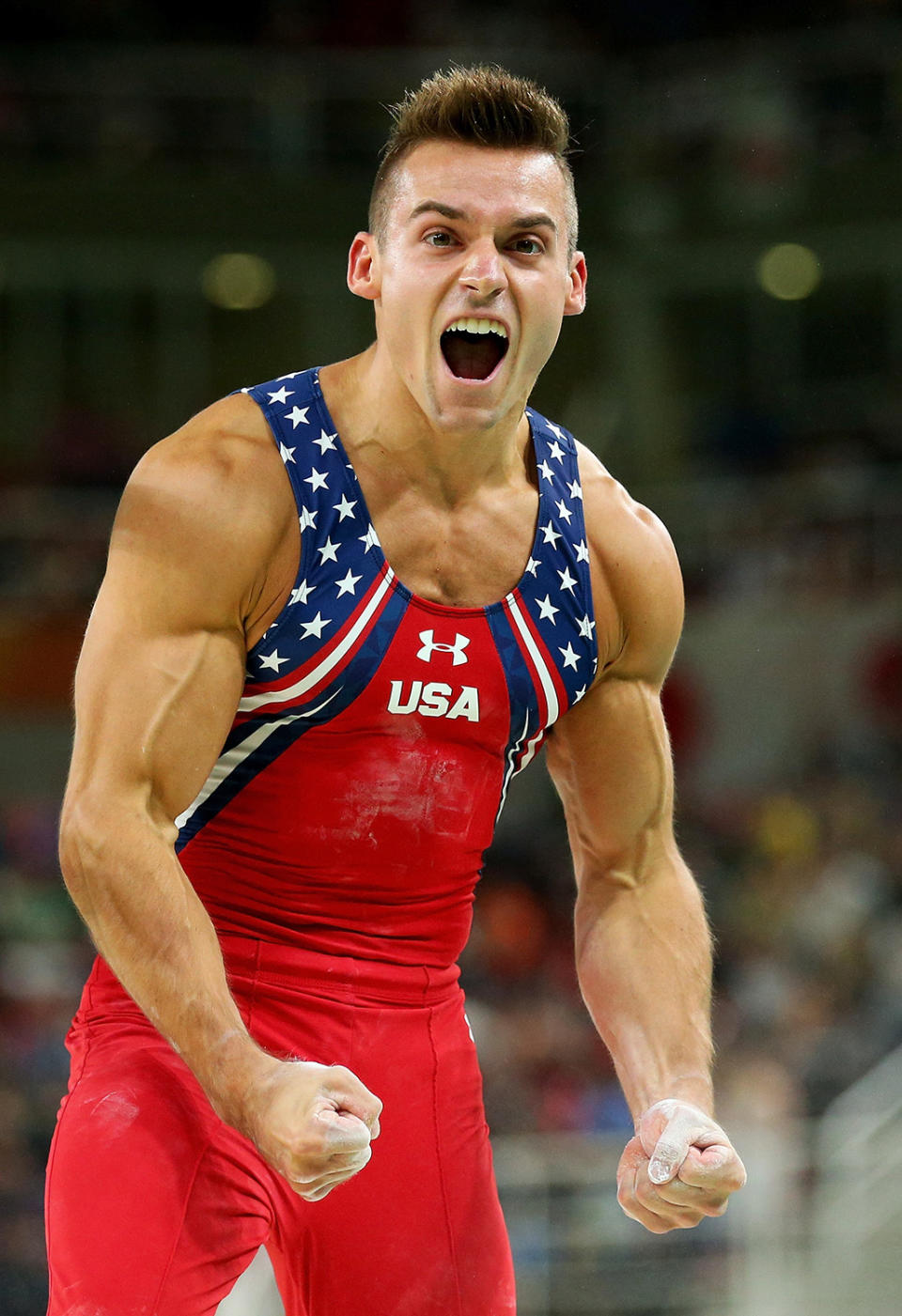 <p>Samuel Mikulak of the United States celebrates after comepting on the parallel bars during the men’s team final on Day 3 of the Rio 2016 Olympic Games at the Rio Olympic Arena on August 8, 2016 in Rio de Janeiro, Brazil. (Photo by Alex Livesey/Getty Images) </p>