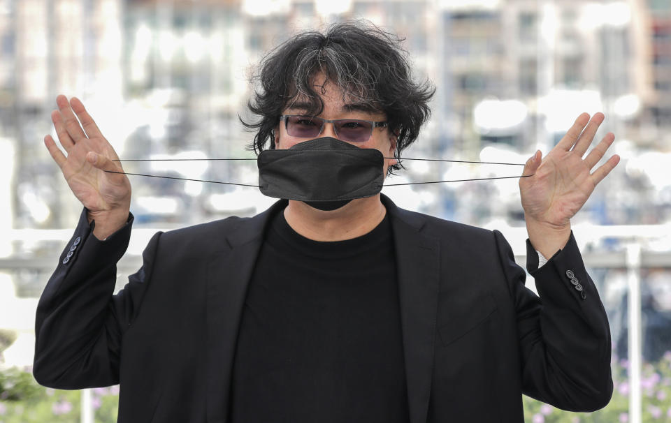 FILE - In this July 7, 2021 file photo Director Bong Joon Ho poses for photographers at a photo call during the 74th international film festival, Cannes, southern France. (Photo by Vianney Le Caer/Invision/AP, File)