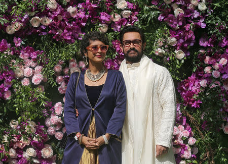 Bollywood actor Aamir Khan and his wife Kiran Rao pose during a photo opportunity at the wedding ceremony of Akash Ambani, son of the Chairman of Reliance Industries Mukesh Ambani, at Bandra-Kurla Complex in Mumbai, India, March 9, 2019. REUTERS/Francis Mascarenhas