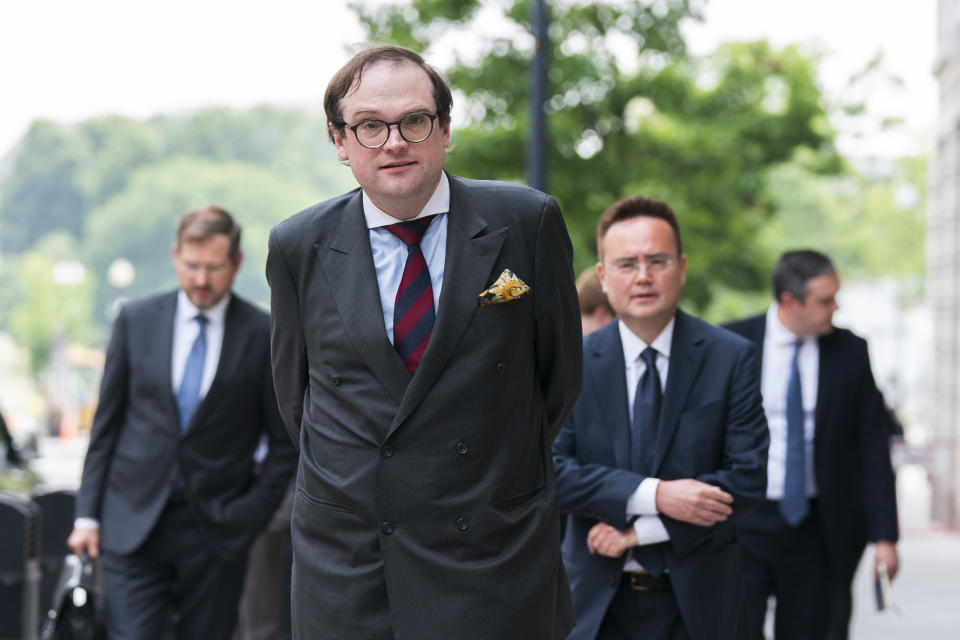 Samuel Dewey representing the conservative think tank The Heritage Foundation, center, and Nile Gardiner, director of the Margaret Thatcher Center for Freedom at The Heritage Foundation, right, walk to speak to reporters outside the federal courthouse in Washington, Tuesday, June 6, 2023. he Heritage Foundation is suing President Joe Biden's administration to force officials to release Prince Harry's immigration files, after the Duke of Sussex admitted to using illegal drugs. (AP Photo/Manuel Balce Ceneta)