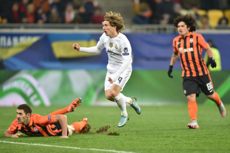 Real Madrid's midfielder Luka Modric (C) reacts after scoring during a UEFA Champions League match against Shakhtar Donetsk in Lviv on November 25, 2015