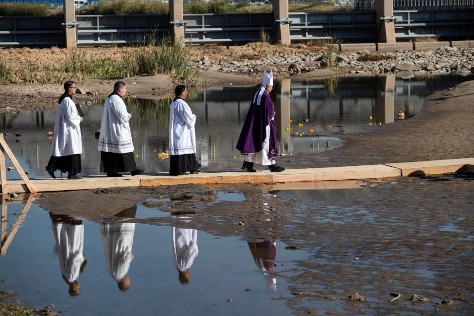 José Guadalupe Torres Campos, the Catholic bishop of Ciudad Juárez, leads members of his clergy towards the middle of the Rio Grande to participate in a Mass in November given in honor of migrants who have died at the border