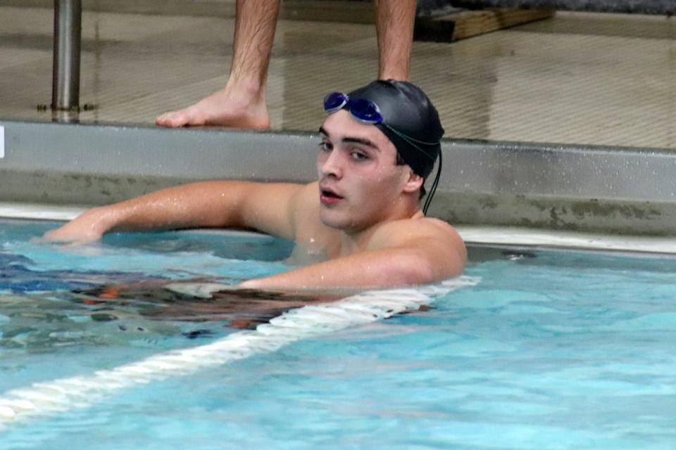 Gardner co-op swimmer Jacob Pervier (Narragansett) catches his breath after finishing his leg in the 200 relay vs. Grafton.