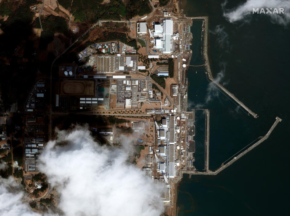 This satellite image provided by Maxar Technologies shows overview of Fukushima Daiichi nuclear power plant in Okuma, Fukushima prefecture, Japan after an earthquake and tsunami on March 12, 2011. Japan will mark the 10th anniversary of the 2011 earthquake, tsunami and nuclear disaster, on Thursday, March 11, 2021. (Satellite image ©2021 Maxar Technologies via AP)