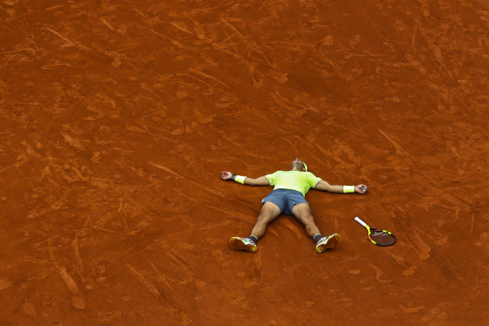 FILE - Spain's Rafael Nadal celebrates his record 12th French Open tennis tournament title after winning his men's final match against Austria's Dominic Thiem in four sets, 6-3, 5-7, 6-1, 6-1, at the Roland Garros stadium in Paris, June 9, 2019. The French Open, the year’s second Grand Slam tennis tournament, is scheduled to start Sunday on the red clay of Roland Garros on the outskirts of Paris. (AP Photo/Pavel Golovkin, File)