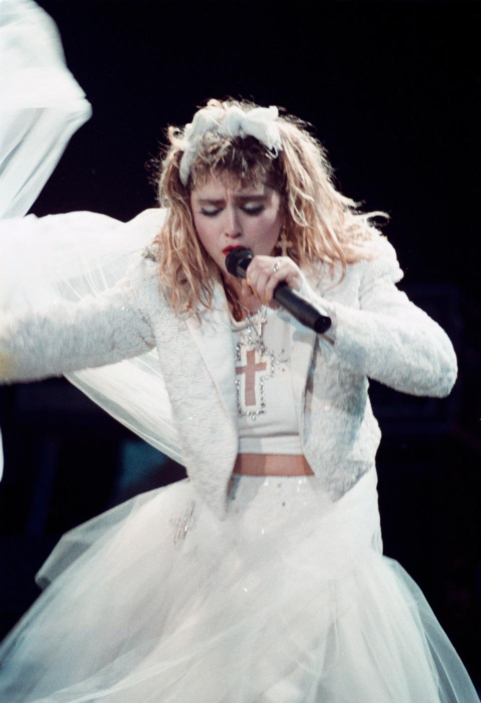 The cross motif made an appearance during Madonna&rsquo;s Virgin tour. Here she is performing in Minnesota on May 21.