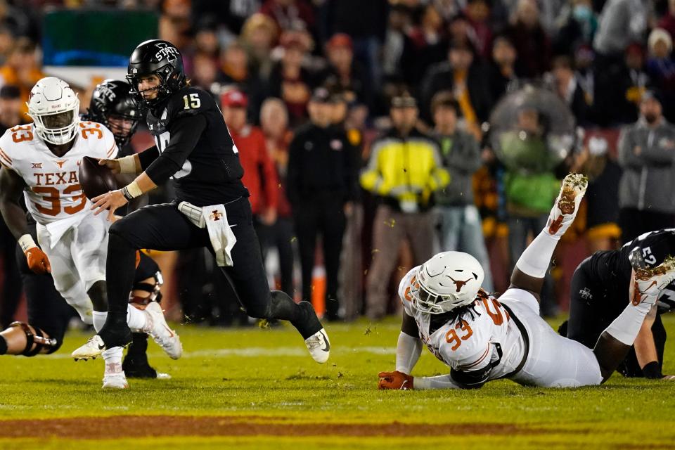 Texas defenders T'Vondre Sweat and David Gbenda pursue Iowa State quarterback Brock Purdy in their 2021 game in Ames. Both Longhorns signed with Texas as part of the No. 3 national signing class.