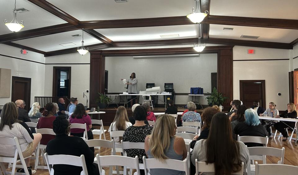 Kim Barton, Alachua County supervisor of elections, reads a vote out to those attending a vote count in Newberry, Fla. on April 17, 2024. The count determines whether or not three public schools in Newberry will convert to public charter schools.