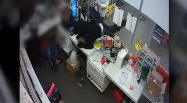 The other stormed over the counter, terrifying the 23-year-old shopkeeper.  Source: Victoria Police