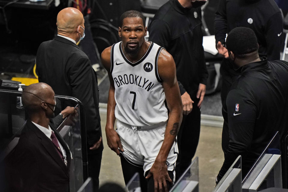 Brooklyn Nets forward Kevin Durant (7) leaves the court after a play during the first half of an NBA basketball game against the Miami Heat, Sunday, April 18, 2021, in Miami. (AP Photo/Wilfredo Lee)