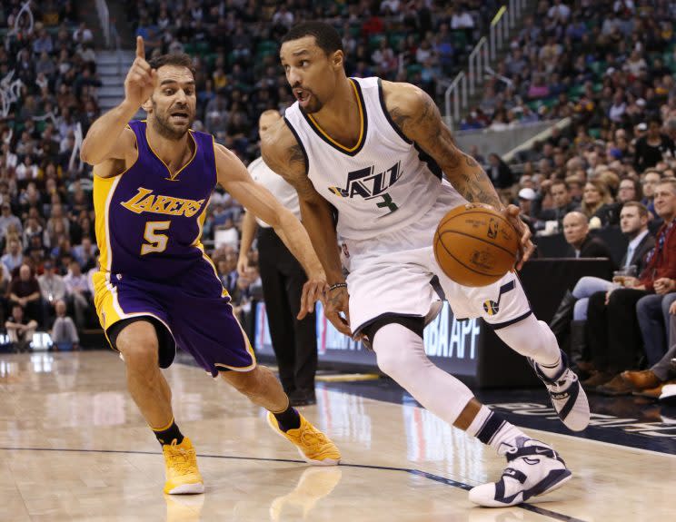 Jose Calderon attempts to stop George Hill by technicality. (AP)