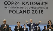 Michal Kurtyka, a senior Polish official chairing the negotiations, poses for a photo after adopting the final agreement during a closing session of the COP24 U.N. Climate Change Conference 2018 in Katowice, Poland, Saturday, Dec. 15, 2018. (AP Photo/Czarek Sokolowski)