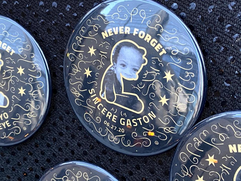 A tribute to Sincere Gaston hangs on the Tree of Remembrance at Daley Plaza in Chicago on Dec. 14, 2020. Gaston, 20 months old, was shot and killed while riding in a car with his mother on the way home from the laundromat.