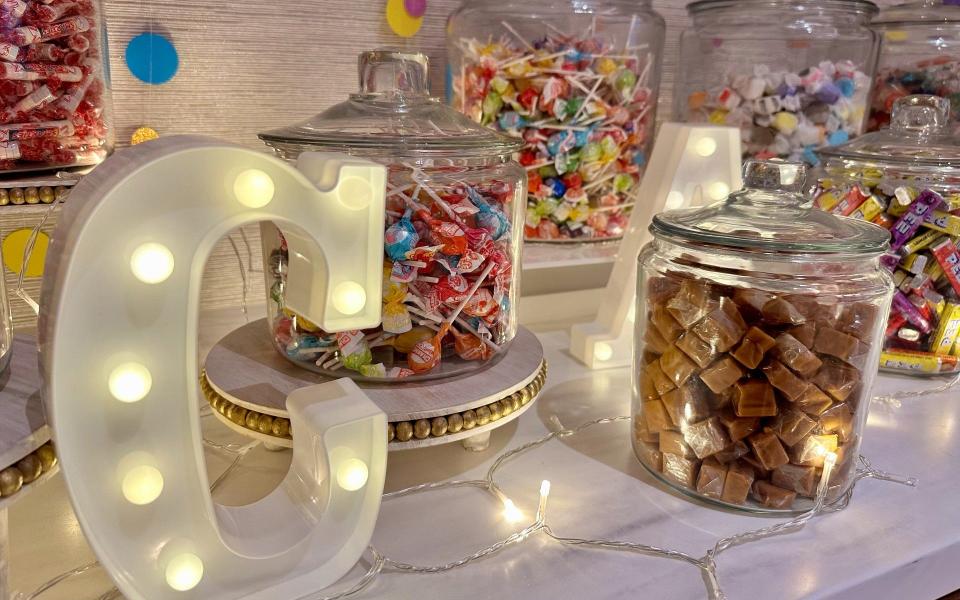 A 6-foot-tall melting rainbow Popsicle sculpture next to a candy counter brimming with Smarties, Pez, and Starburst was an inspired touch.