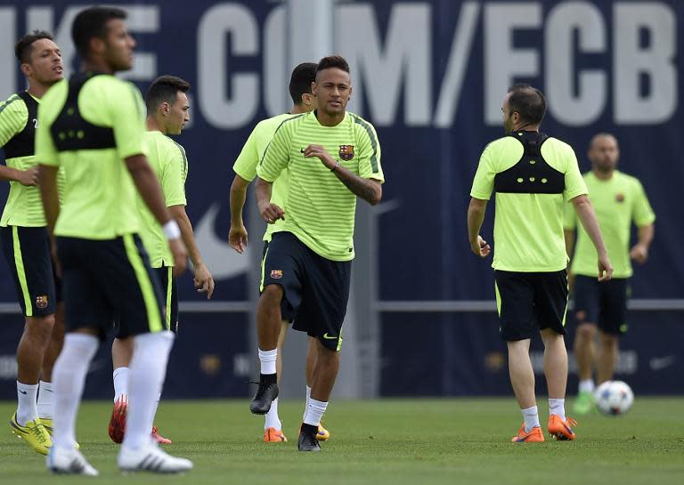 Barcelona's Neymar (C) trains with his teammates at the Sports Center FC Barcelona Joan Gamper on April 5, 2015, on the eve of their Champions League semi-final first leg football match against Bayern Munich