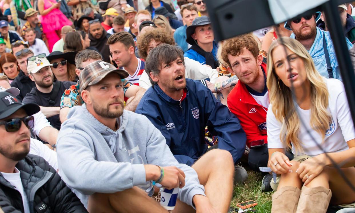 <span>Louis Tomlinson and England fans watch the football at Glastonbury.</span><span>Photograph: Jonny Weeks/The Guardian</span>