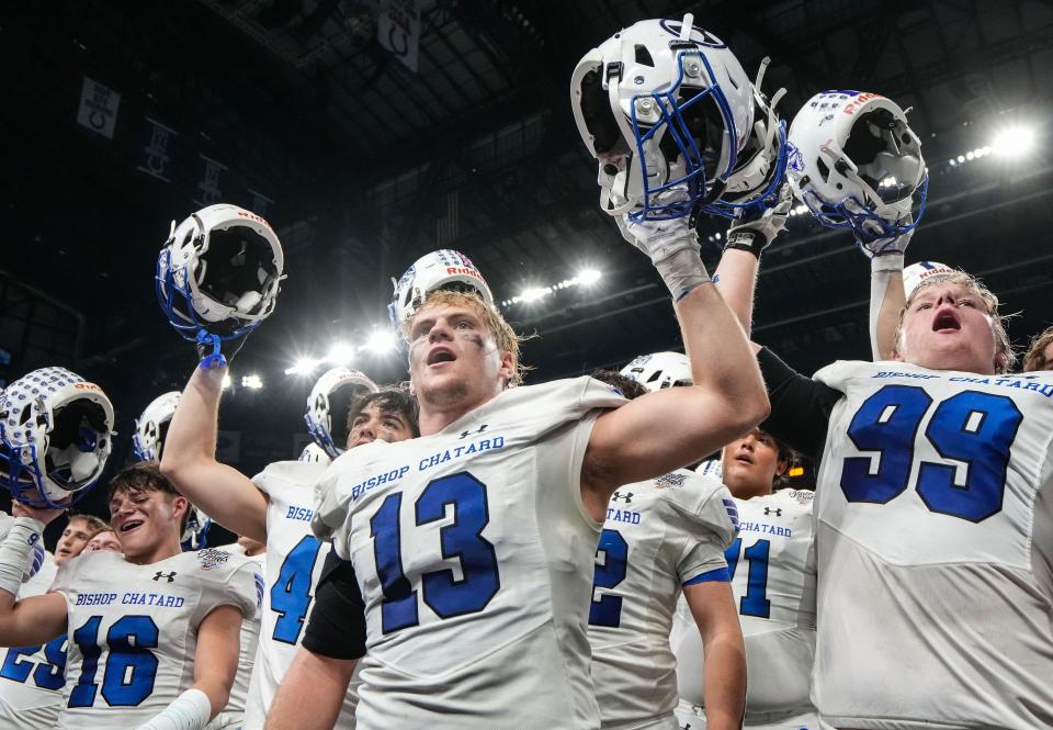 Indianapolis Bishop Chatard Trojans Luke Purichia (13) leads his teammates singing the fight song after defeating Heritage Hills Patriots on Friday, Nov. 24, 2023, during the IHSAA Class 3A football state championship game at Lucas Oil Stadium in Indianapolis. The Indianapolis Bishop Chatard Trojans defeated the Heritage Hills Patriots, 35-7.