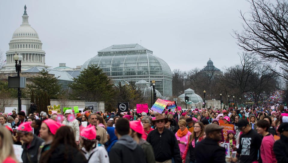 <p>Demonstrators march past the US Capito on the National Mall in Washington, D.C., for the Women’s March on Washington, January 21, 2017. (JIM WATSON/AFP/Getty Images) </p>