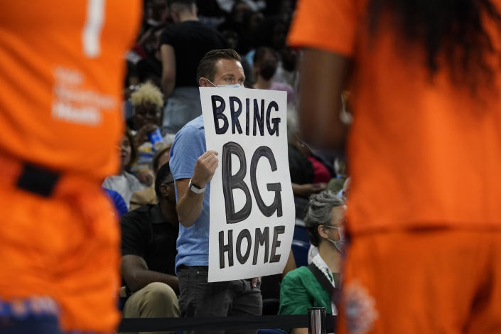 A person holds up a sign reminding fans of Phoenix Mercury's Brittney Griner during the first half of Game 2 in a WNBA basketball playoffs semifinal between the Chicago Sky and the Connecticut Sun on Wednesday, Aug. 31, 2022, in Chicago. (AP Photo/Nam Y. Huh)