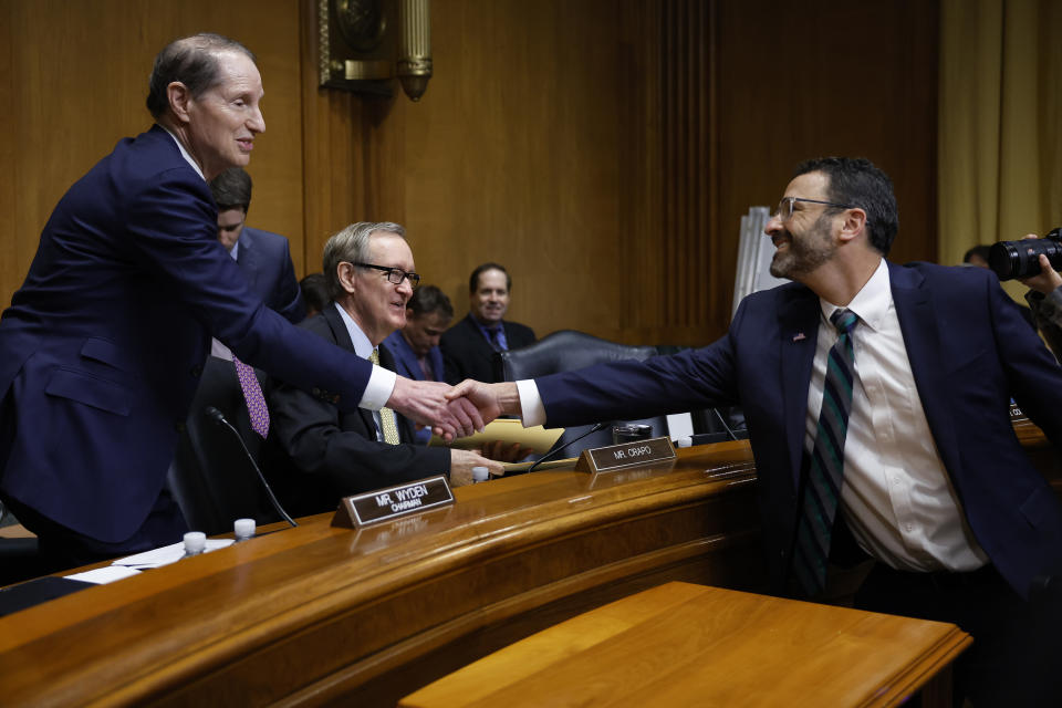 WASHINGTON, DC - APRIL 19: Internal Revenue Service Commissioner Daniel Werfel (R) greets Senate Finance Committee Chairman Ron Wyden (D-OR) (L) and ranking member Sen. Mike Crapo (R-ID) before testifying about the Biden Administration's proposed budget request for FY2024 and the 2023 tax filing season in the Dirksen Senate Office Building on Capitol Hill on April 19, 2023 in Washington, DC. Confirmed by the Senate in March of this year, Werfel is tasked with overseeing the IRS's $80 billion overhaul to modernize its technology and enhance its abilities to crack down on tax cheats. (Photo by Chip Somodevilla/Getty Images)