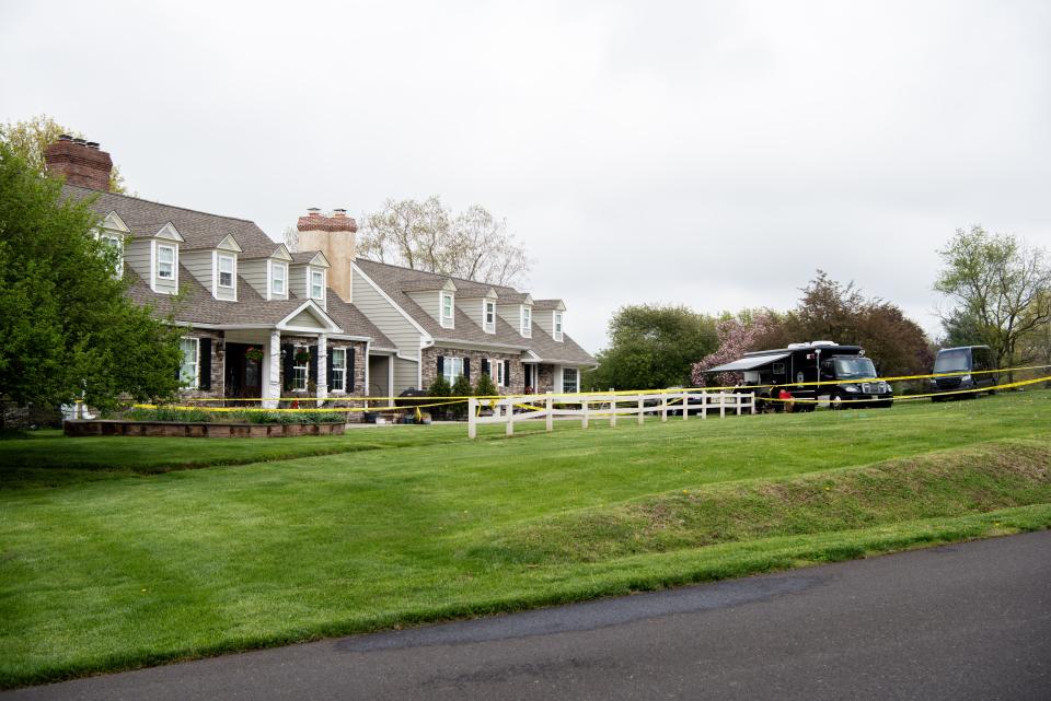 Crime scene tape surrounds an Upper Makefield home where two boys, 10 and 13 years old, were shot Monday morning. Their mother, 38-year-old Trinh Nguyen, was arrested and charged in the shooting, according to Bucks County District Attorney Matthew Weintraub.