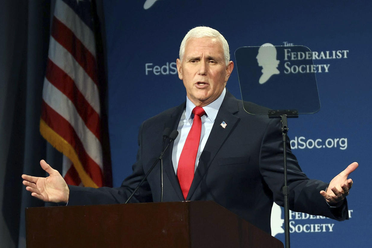 CORRECTS DATELINE TO LAKE BUENA VISTA, NOT ORLANDO - Former Vice President Mike Pence speaks at the Florida chapter of the Federalist Society's annual meeting at Disney's Yacht Club resort in Walt Disney World on Friday, Feb. 4, 2022, in Lake Buena Vista, Fla. Pence, on Friday, directly rebutted Donald Trump's false claims that Pence somehow could have overturned the results of the 2020 election, saying that the former president was simply “wrong.”  (Stephen M. Dowell/Lake Buena Vista Sentinel via AP)