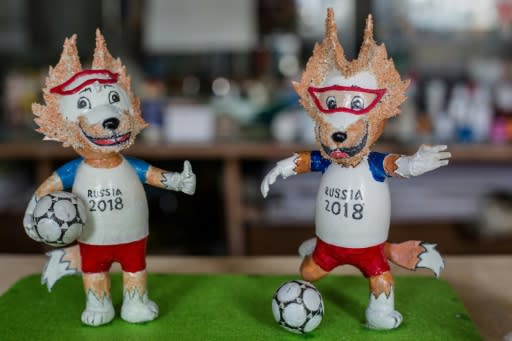 Most of the tiny statues are of tournament mascot Zabivaka, a wolf in sports goggles kicking a football