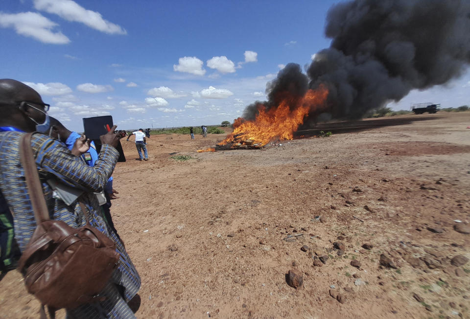 In this photo released by The United Nations Office on Drugs and Crime, shows officials burning seized drugs in Niamey, Niger, Monday, June 26, 2023. Drug seizures soared in the West African Sahel region according to figures released Friday April 19, 2024 in a new U.N. report, indicating the conflict-ridden region is becoming an influential route for drug trafficking. In 2022, 1,466 kilograms, [3,232 pounds], of cocaine were seized in Mali, Chad, Burkina Faso and Niger compared to an average of 13 kilograms [28.7 pounds] between 2013 and 2020 , said the report from the U.N. Office on Drugs and Crime. (UNODC via AP)