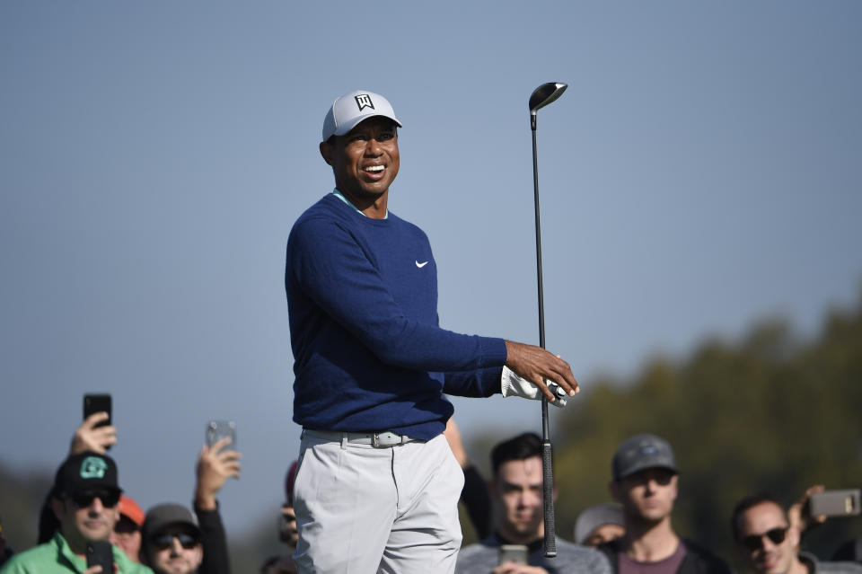 Tiger Woods watches the flight of his tee shot on the second hole of the South Course at Torrey Pines Golf Course during the third round of the Farmers Insurance golf tournament Saturday Jan. 25, 2020, in San Diego. (AP Photo/Denis Poroy)