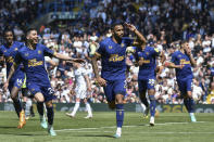 Newcastle's Callum Wilson, center, celebrates with teammates after scoring his side's 2nd goal from the penalty spot during the English Premier League soccer match between Leeds United and Newcastle United at Elland Road in Leeds, England, Saturday, May 13, 2023. (AP Photo/Rui Vieira)