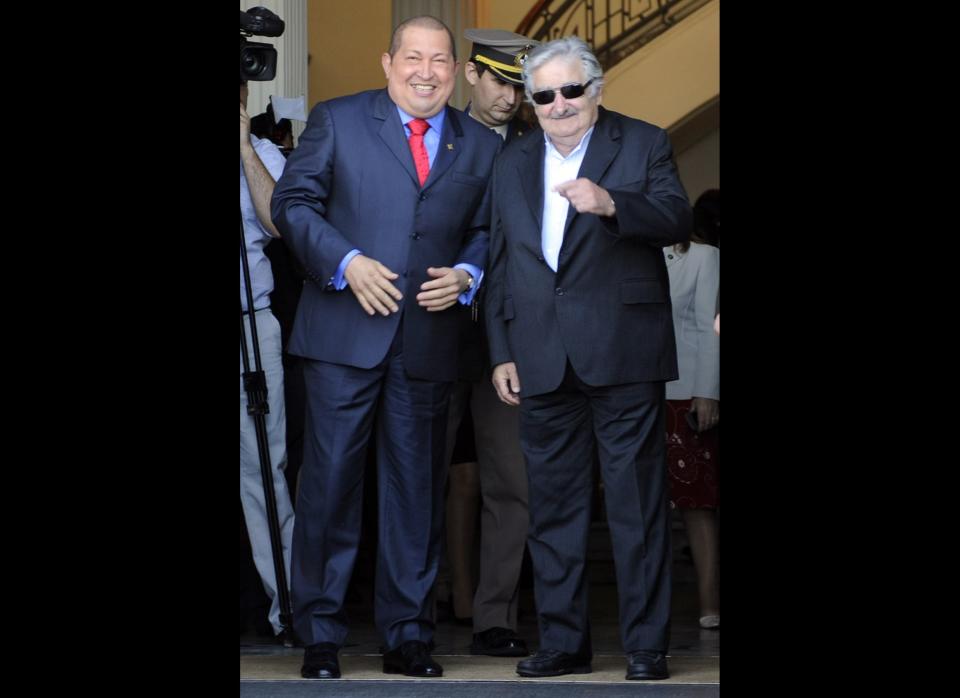 Venezuelan President Hugo Chavez (L) is welcomed by Uruguayan President Jose Mujica during the XLII Mercosur Summit in Montevideo on December 20, 2011. Argentina, Brazil, Paraguay and Uruguay are Mercosur founding full members, while Venezuela is in the process of incorporation, and Chile, Bolivia, Peru, Colombia and Ecuador are associate members.  AFP PHOTO / DANIEL CASELLI (Photo credit should read DANIEL CASELLI/AFP/Getty Images)