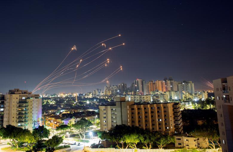 Streaks of light are seen from Ashkelon as Israel's Iron Dome anti-missile system intercepts rockets launched from the Gaza Strip toward Israel on May 15, 2021. / Credit: Amir Cohen / Reuters