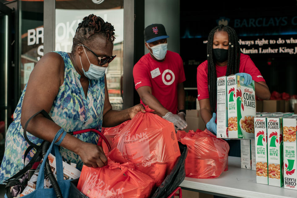 NEW YORK, NY - JULY 30: New Yorkers in need receive free produce, dry goods, and meat at a Food Bank For New York City distribution event at the Barclays Center on July 30, 2020 in New York City. Alongside unemployment and homelessness, millions of Americans face food insecurity as a result of the economic downturn caused by the coronavirus pandemic. (Photo by Scott Heins/Getty Images)