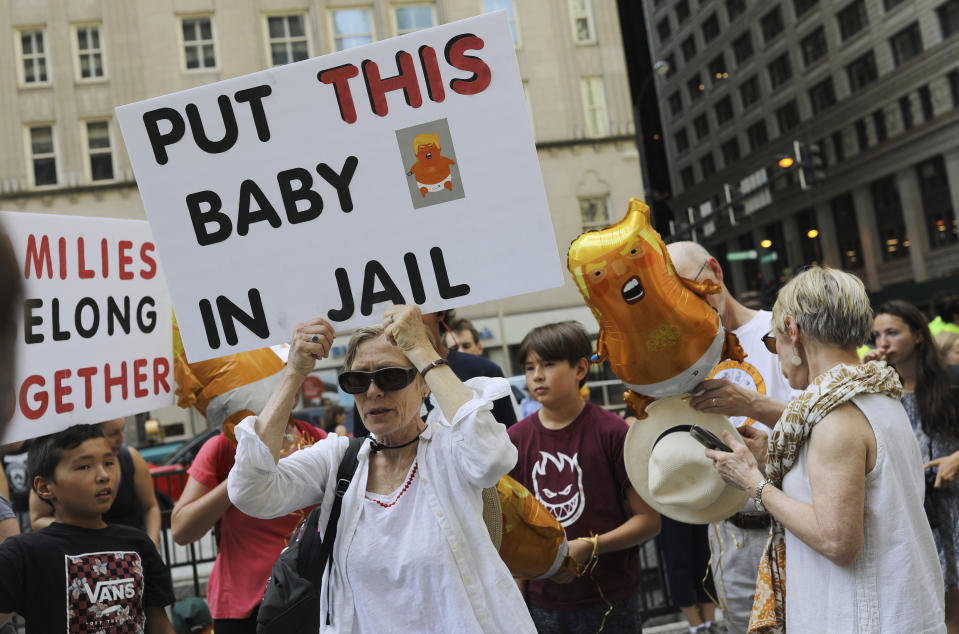 Thousands of people, including immigrants and their supporters, rally against President Trump's immigration policy, especially the detention of children, marching from Daley Plaza to the Chicago field office for Immigration and Customs Enforcement,, Saturday, July 13, 2019 in Chicago. (Abel Uribe/Chicago Tribune via AP)