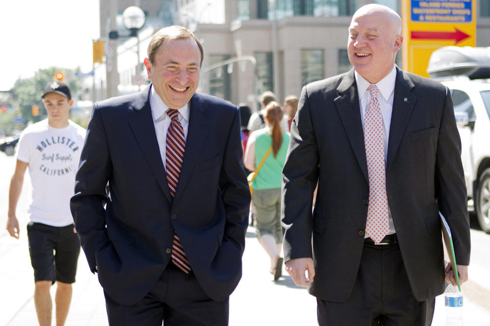 NHL commissioner Gary Bettman, left, and deputy commisioner and chief legal officer Bill Daly, Deputy Commissioner leave the NHLPA offices in Toronto on Wednesday, Aug. 22, 2012. Negotiations continue between the NHL and the NHLPA over collective bargaining as both sides try to avoid a potential lockout. (AP Photo/The Canadian Press, Chris Young)