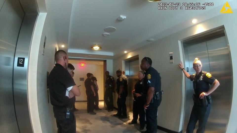 Officers waiting near the elevator at the Marriott Waterside hotel in Tampa. Eleven officers responded to a call about Freddy Ramirez and Jody Ramirez while they attended the Florida Sheriffs Association conference.