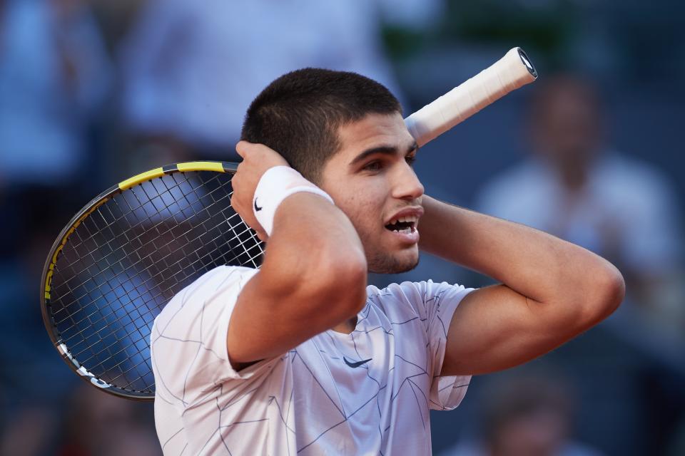 Carlos Alcaraz (pictured) reacts after defeating Rafa Nadal at the Madrid Open.